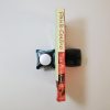 A vertical shot features a copy of 'The Alchemist' by Paulo Coelho placed flat on a surface with its spine facing upward. The book's spine is red with white and yellow text displaying the title and author's name. - - The Paperhound Online Bookshop. Secondhand books for sale online in South Africa.
